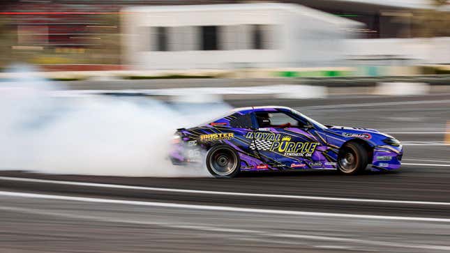 A photo of a drift car racing in an event. 