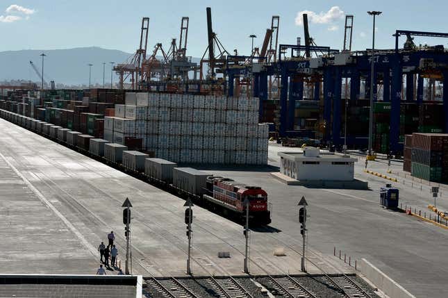 FILE - A freight train line at the port of Piraeus during its inauguration on June 20, 2014. Greece Monday Feb. 26, 2024 formally agreed to participate in and lead a European Union maritime security operation in the Red Sea, to protect commercial shipping from attacks by Houthi militants in Yemen. Greece, a major commercial shipping power, has been directly affected by the Houthi attacks. The port of Piraeus, near Athens, reported a 12.7% drop in activity at its container terminal in January, on an annual basis. (AP Photo/Louisa Gouliamaki, Pool, File)