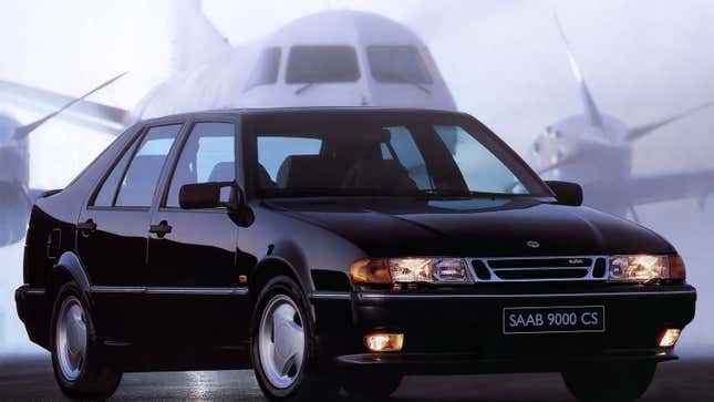 A black Saab 9000 sedan 