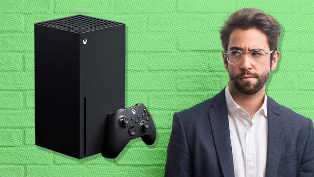 An image shows a business man looking at an Xbox console suspiciously. 