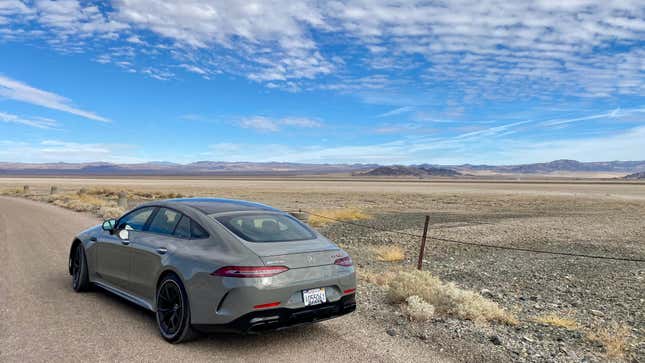 A rear three quarters shot of the gray AMG GT63 S E Performance parked in the desert