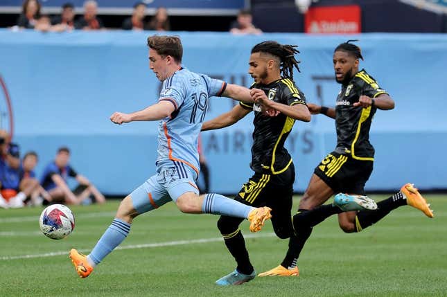 Jun 17, 2023; New York, New York, USA; New York City FC forward Gabriel Segal (19) scores a goal against Columbus Crew SC defenders Mohamed Farsi (23) and Steven Moreira (31) during the second half at Yankee Stadium.