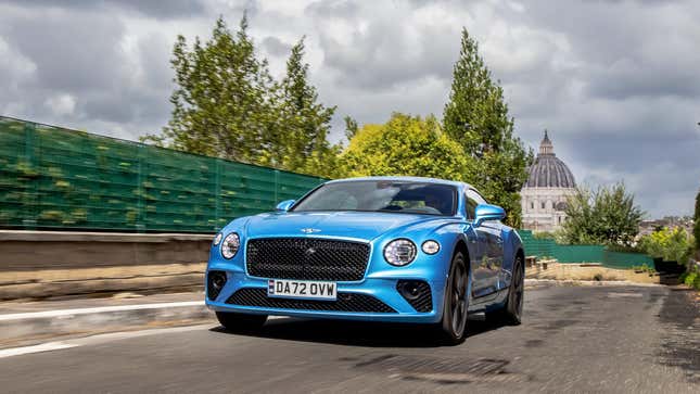 A blue Bentley Continental GT driving around Rome