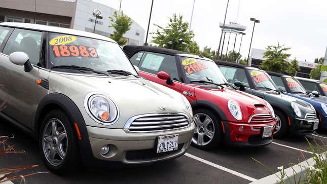 A line of Minis at a used car lot