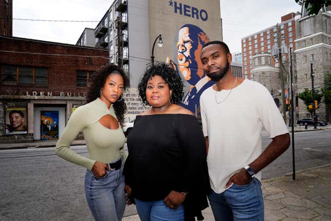 D’Zhane Parker, left, Cicley Gay, center, and Shalomyah Bowers pose for a portrait on Friday, May 13, 2022, in Atlanta.