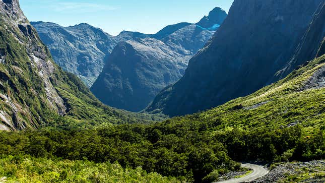 A photo of Highway 94 in New Zealand weaving through mountains. 