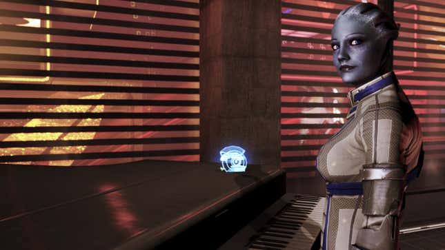 Liara stands in front of a piano.