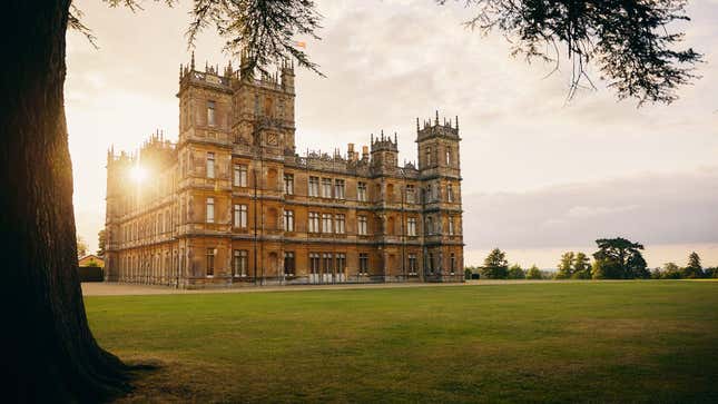 An exterior photo of Highclere Castle, the massive property used to film Downton Abbey, is shown.