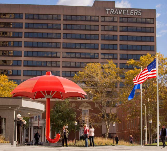 A photo of the red Travelers umbrella outside the Travelers office