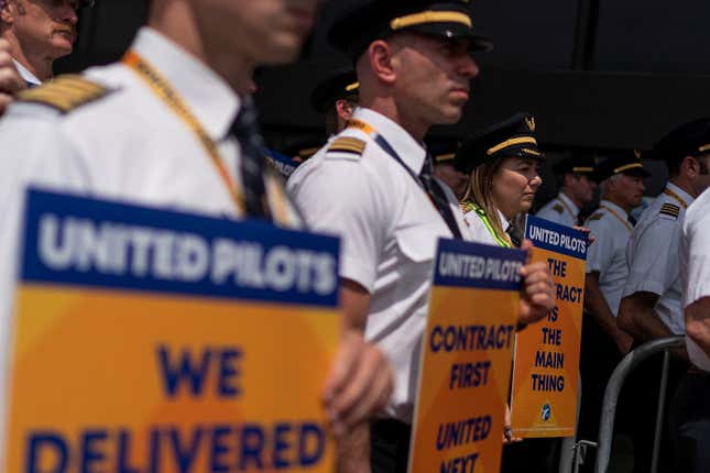 Pilots from United Airlines take part in an informational 2023 picket at Newark Liberty International Airport in Newark, New Jersey