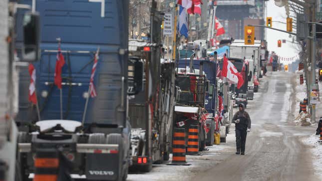 OTTAWA, ONTARIO - FEBRUARY 16: Trucks participate in a blockade of downtown streets near the parliament building as a demonstration led by truck drivers protesting vaccine mandates continues on February 16, 2022 in Ottawa, Ontario, Canada Prime Minister Justin Trudeau has invoked the Emergencies Act for the first time in Canada’s history to try to put an end to the blockade which is now in it’s third week. 