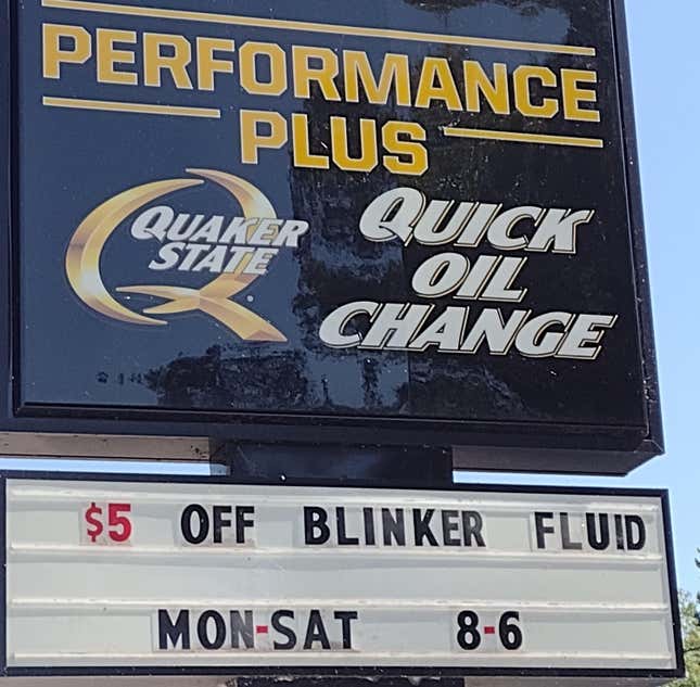 A sign saying five dollars off blinker fluid