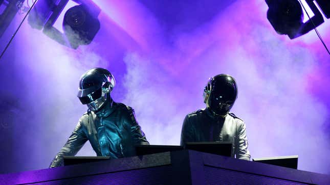 A photo of Daft Punk performing live. 