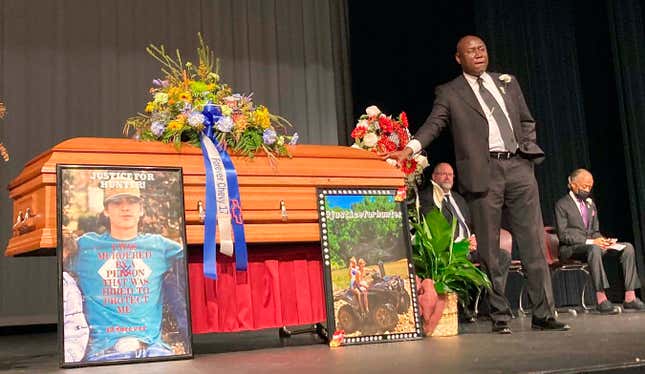 Attorney Ben Crump stands next to Hunter Brittain’s casket at the Beebe High School Auditorium before his memorial service in Beebe, Ark., on Tuesday, July 6, 2021. Brittain was shot and killed by a Lonoke County Sheriff’s deputy during a traffic stop June 23. 