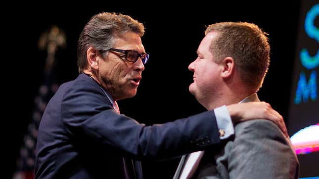 File photo of conservative commentator Erick Erickson (right), who shared the fake viral “masturbation” image, is seen with former Texas Gov. Rick Perry (left) in 2015.