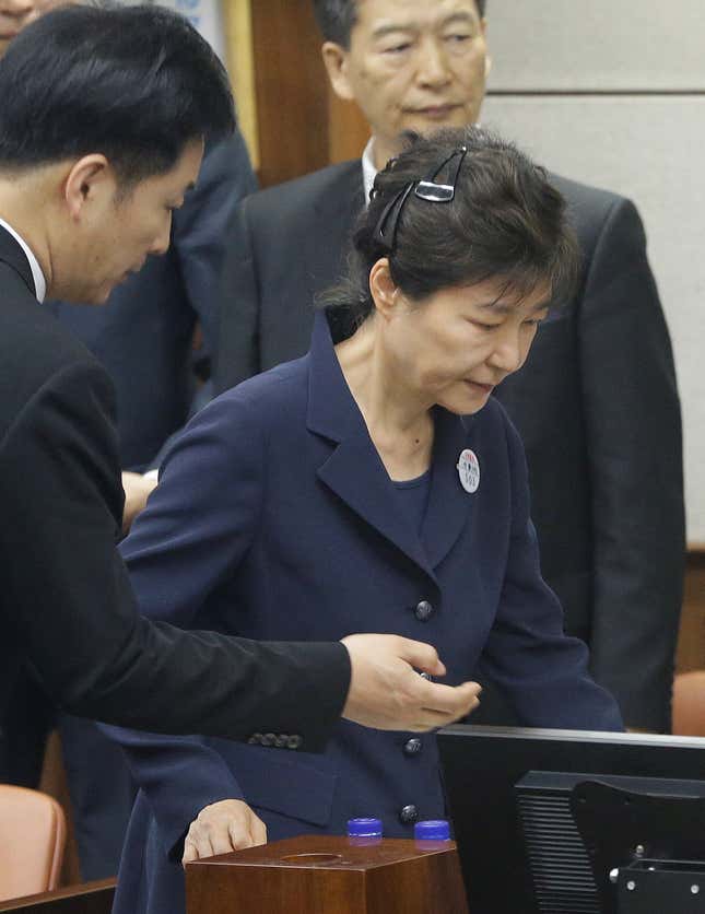 Former South Korean President Park Geun-hye arrives Tuesday for her trial at the Seoul Central District Court.