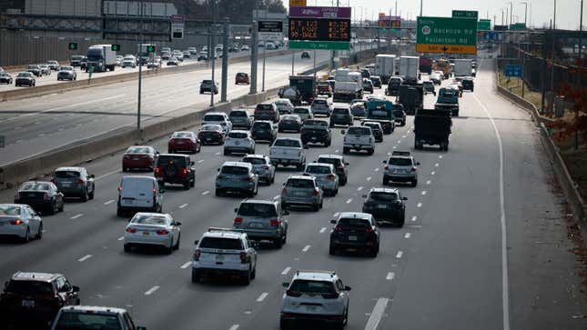 A photo of slow moving traffic on the I-95 highway. 