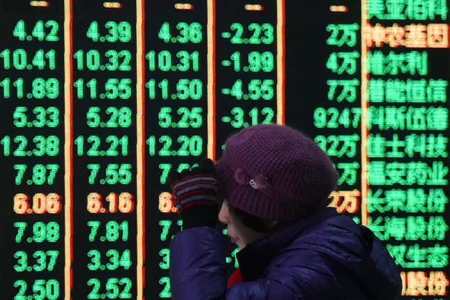 FILE - A woman reacts in front of an electronic screen displaying stock prices at a brokerage house in Hangzhou in east China&#39;s Zhejiang province, on Feb. 5, 2024. A Chinese state investment fund has promised to expand its purchases of stock index funds to help markets that have been sagging under heavy selling pressure from a property crisis and slowing economy. (Chinatopix via AP, File)