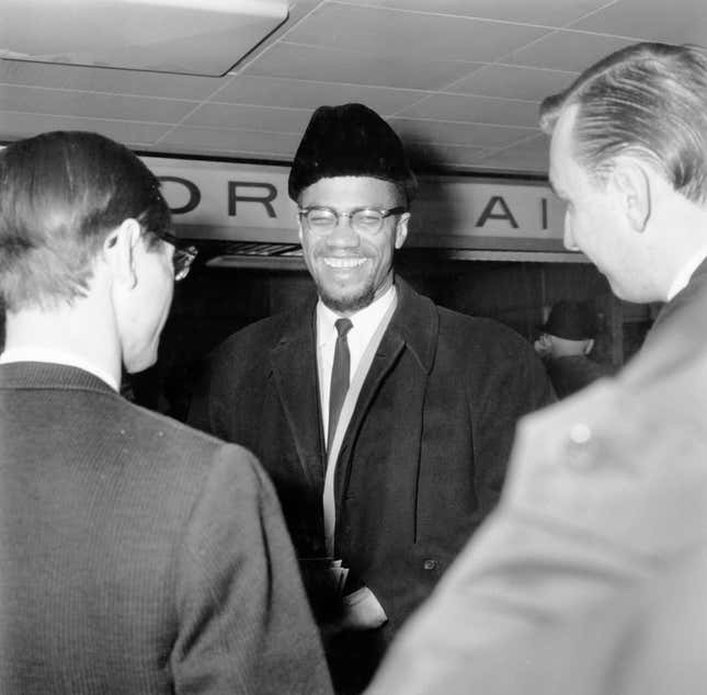Malcolm X (1925 - 1965) at London Airport (now Heathrow), 17th February 1965.