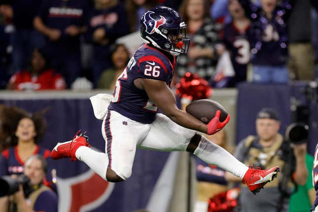 Devin Singletary of the Houston Texans scores a 19-yard touchdown against the Cleveland Browns during the fourth quarter in the AFC Wild Card Playoffs at NRG Stadium.