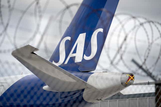 FILE - An SAS aircraft is parked on the ground during the pilot strike, at Copenhagen Airport, on July 18, 2022. Shares in Scandinavian Airlines dropped more than 90% on Wednesday Oct. 4, 2023 after the ailing carrier announced new shareholders in a restructuring scheme that will see the company delisted and existing ownership stakes erased. (Liselotte Sabroe/Ritzau Scanpix via AP, File)