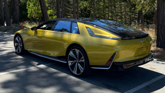 Rear 3/4 view of a yellow Cadillac Celestiq