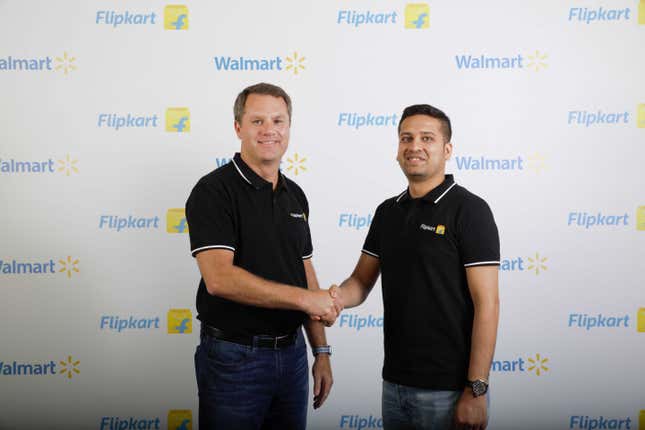 Walmart CEO Doug McMillon (L) and Flipkart co-founder Binny Bansal.