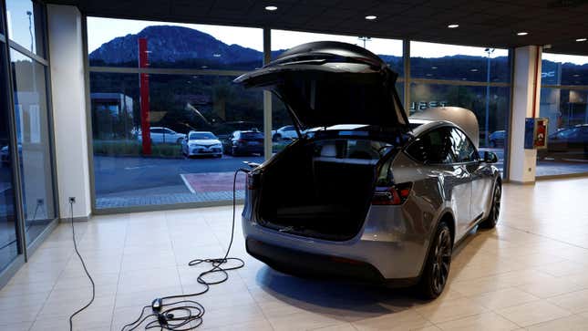 Tesla electric vehicle is charged up at a dealership in Durango, northern Spain, October 30, 2023.