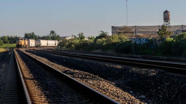 A freight train travels through Houston on September 14, 2022 in Houston, Texas. 