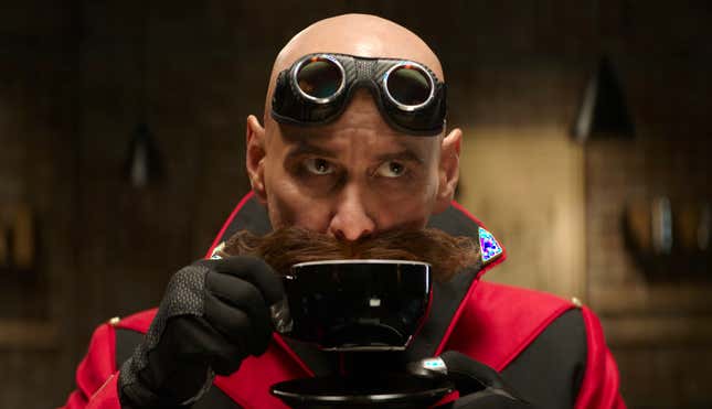 Robotnik (played by Jim Carrey) sips a cup of coffee from a black mug in a Sonic the Hedgehog 2 image.