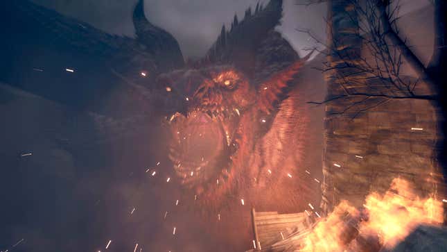 A red-colored Dragon's Dogma 2 dragon roars at the camera as things catch fire and burn down around it.
