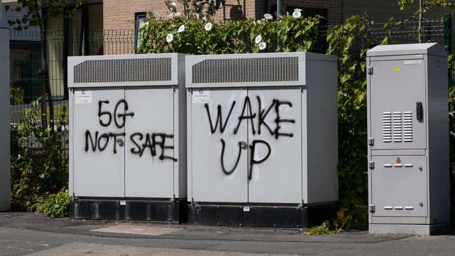 Graffiti on telecom equipment in Batley, the UK, promoting conspiracy theories about 5G connectivity technology in July 2021.