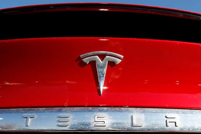 FILE - In this Feb. 2, 2020, file photo, the Tesla company logo is shown in Littleton, Colo. Tesla is recalling nearly all of the vehicles it has sold in the U.S. because some warning lights on the instrument panel are too small. Documents posted Friday, Feb. 2, 2024 by U.S. safety regulators say the recall will be done with an online software update. (AP Photo/David Zalubowski, File)