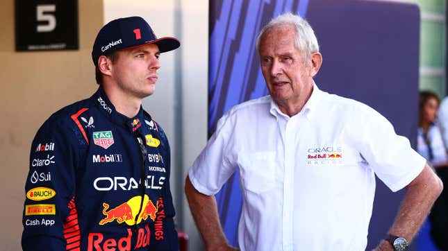 Max Verstappen of the Netherlands and Oracle Red Bull Racing and Red Bull Racing Team Consultant Dr Helmut Marko talk at the Red Bull Racing Team Photo prior to the F1 Grand Prix of Abu Dhabi at Yas Marina Circuit on November 26, 2023 in Abu Dhabi, United Arab Emirates. 