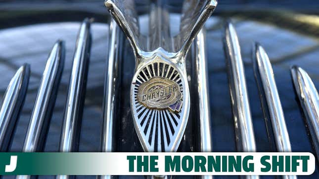 A photo of a vintage Chrysler badge on a car. 