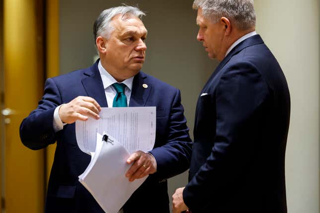 Slovakia&#39;s Prime Minister Robert Fico, right, talks to Hungary&#39;s Prime Minister Viktor Orban during a round table meeting at an EU summit in Brussels, Thursday, Feb. 1, 2024. European Union leaders meet in Brussels for a one day summit to discuss the revision of the Multiannual Financial Framework 2021-2027, including support for Ukraine. (AP Photo/Geert Vanden Wijngaert)