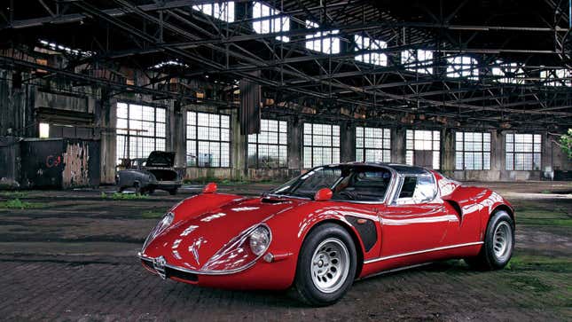 A photo of a red Alfa Romeo 33 Stradale 