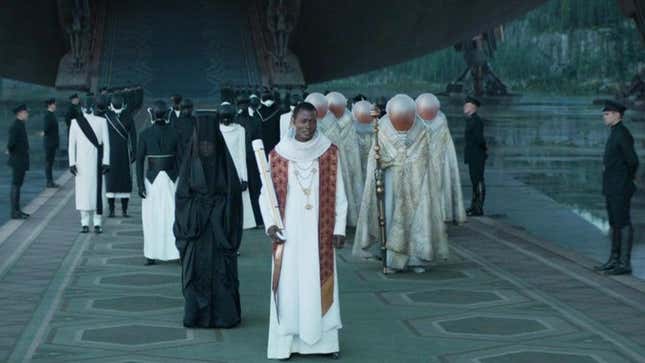 People in white robes and glass masks arrive from a ship. 