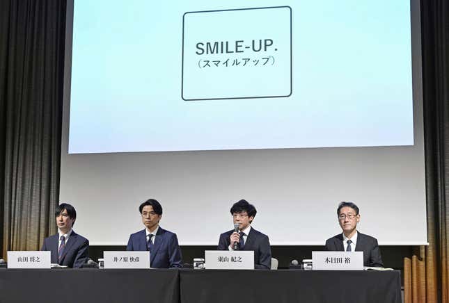 President of Johnny & Associates Noriyuki Higashiyama, center right, and President of the agency's subsidiary Johnnys' Island Yoshihiko Inohara, center left, with lawyers Masayuki Yamada, left, and Hiroshi Kimeda attend a news conference in Tokyo Monday, Oct. 2, 2023. The Japanese entertainment company that has acknowledged its founder sexually assaulted hundreds of boys took a new name Monday, Smile-Up, vowing to focus on compensation for the victims. (Kyodo News via AP)
