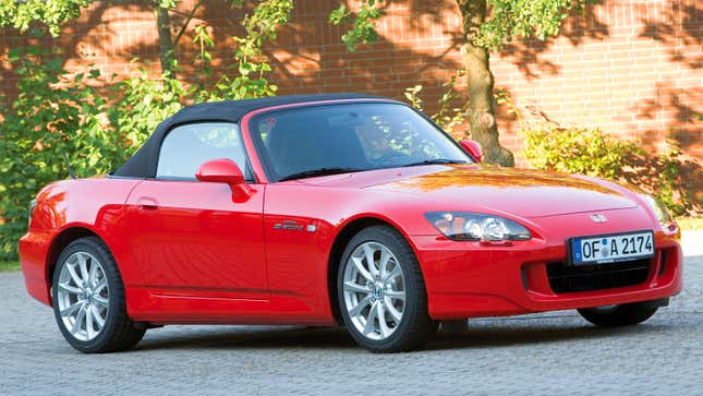 A photo of a red Honda S2000 sports car. 