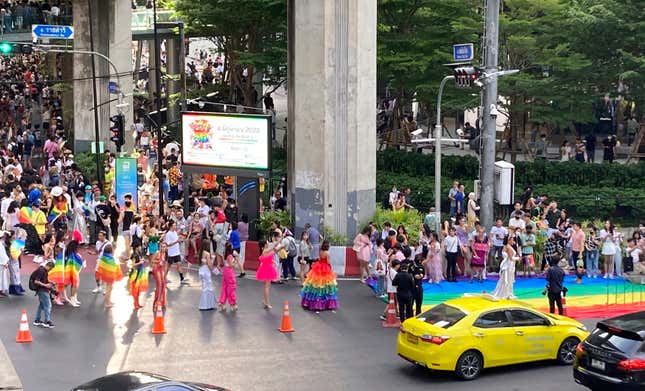 A procession of people dressed in vibrant outfits wait their turn to walk the rainbow carpet at the end of the Pride parade in Bangkok on Sunday, June 4, 2023. LGBTQ+ people from China who are frequently scorned and ostracized at home are coming to Thailand in droves. They&#39;re drawn by the freedom to be themselves. Bangkok is only a 5-hour flight from Beijing, and Thailand&#39;s tourism authorities actively promote its status as among the most open to LGBTQ+ people in the region.(AP Photo/Donna Edwards)