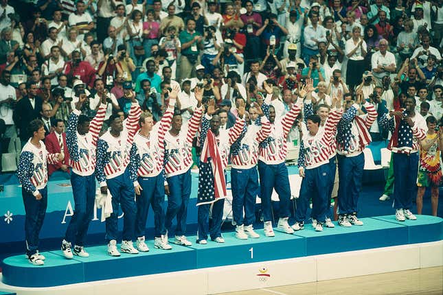 American basketball players of the Dream Team receive their gold medal during the 1992 Olympics. | Location: Barcelona, Spain.