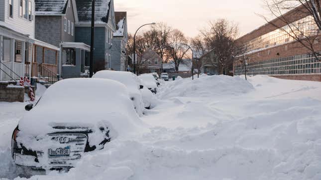 Buried cars line Lowell Place in Buffalo, New York on December 28, 2022.