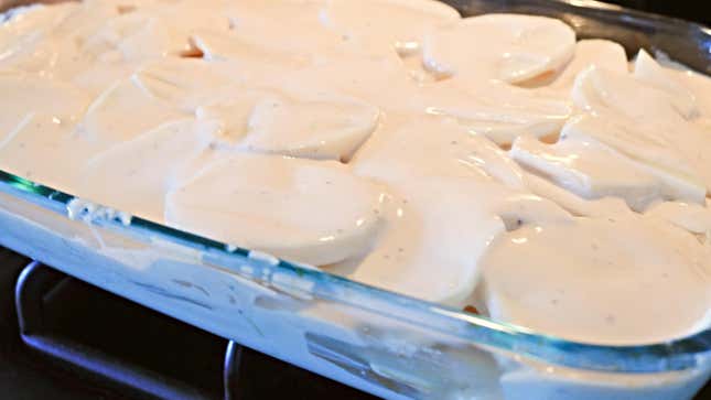 Gratin Potatoes in a casserole dish before baking.