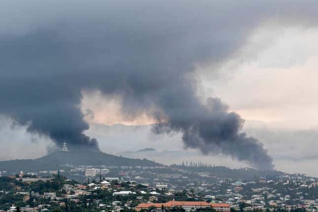 Smoke rises in the distance in Noumea, New Caledonia on May 14, 2024.