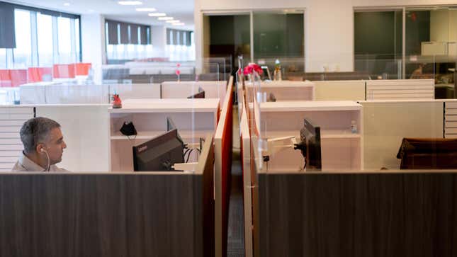 A man works on his computer as the first phase of FMC Corporation employees return to work in the office in Philadelphia, Pennsylvania, U.S., June 14, 2021.