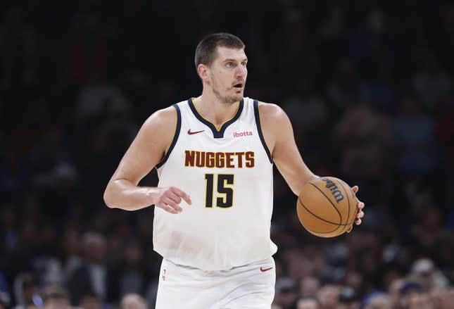 Oct 29, 2023; Oklahoma City, Oklahoma, USA; Denver Nuggets center Nikola Jokic (15) dribbles the ball down the court against the Oklahoma City Thunder during the second quarter at Paycom Center.