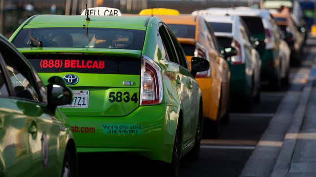 A photo of a line of Toyota Prius taxis in Los Angeles. 