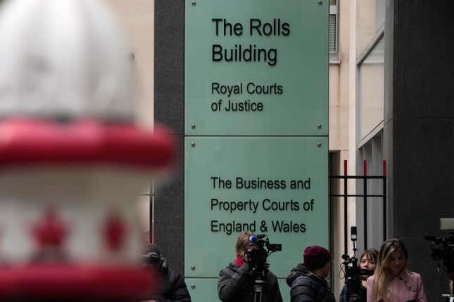 Journalists and TV cameras outside the Royal Courts of Justice, Rolls Building, where Justice Timothy Fancourt gave his ruling in the Prince Harry phone hacking lawsuit in London, Friday, Dec. 15, 2023. Prince Harry has won his phone hacking lawsuit against the publisher of the Daily Mirror and was awarded over 140,000 pounds ($180,000) in the first of his several lawsuits against the tabloids to go to trial. Fancourt found on Friday that phone hacking was &quot;widespread and habitual&quot; at Mirror Group Newspapers over many years. (AP Photo/Kin Cheung)