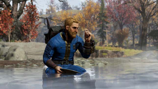 A player in Fallout 76 looks at something tiny while sitting a river. 